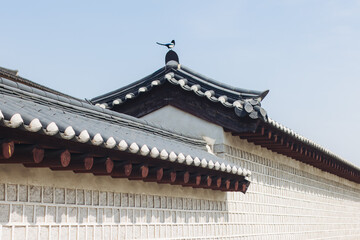 Gyeongbokgung Palace, Seoul, Jongno District, South Korea, in a spring sunny day, exterior view of main Korean royal palace in Cherry Blossom season, with Bugaksan mountain in the background