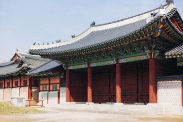 Gyeongbokgung Palace, Seoul, Jongno District, South Korea, in a spring sunny day, exterior view of main Korean royal palace in Cherry Blossom season, with Bugaksan mountain in the background