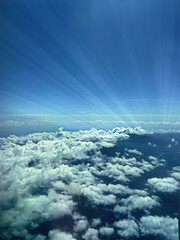 Aerial photography above the clouds - Rays of light with a shining star