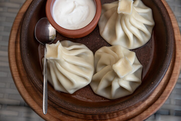 Khinkali - Traditional Georgian dish. Khinkali are traditional dumplings of Caucasian cuisine. Selective focus.