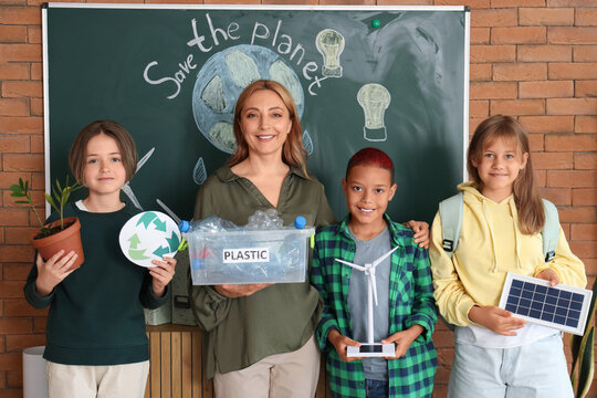 Female teacher with pupils during Ecology lesson in classroom