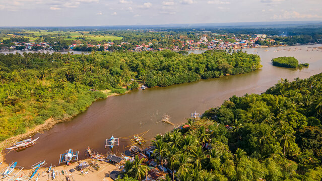 Boats and fishermen at the maragondon river cavite