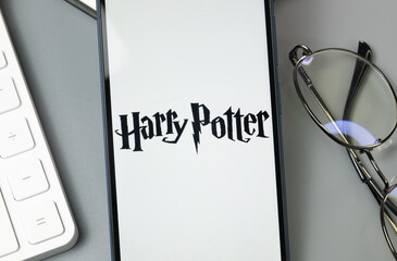 Fototapeta premium New York, USA - 30 August 2024: Harry Potter Logo on Phone Screen, Company Icon on Display