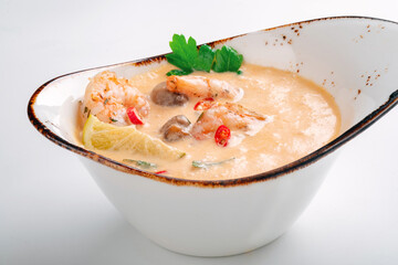 Tom Yam kung soup with shrimp and coconut milk. Traditional Thai