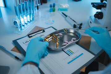 Fototapeta premium a scientist is testing various pills in order to improve their quality an effectiveness in the laboratory, a chemist is testing the chemistry of various pill capsules in a medicine laboratory