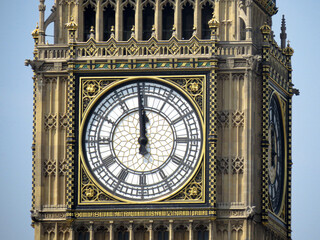 A clear view of Big Ben with a bright sky in the background, highlighting the intricate architecture of the clock tower. Iconic London landmark.