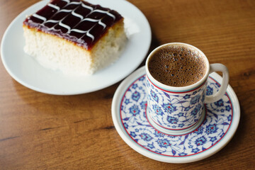 Experience the Joy of Coffee and Cake Delight Artfully Displayed on a Rustic Wooden Table