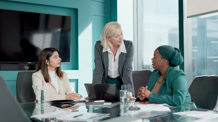 Business women, laptop and proposal for partnership, meeting or project management in office. Professional, people and talk with discussion, communication and planning for recruitment at workplace