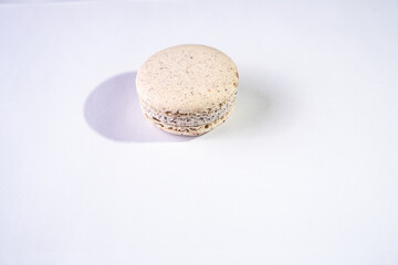 This is a French cookie called a macaron. It is two cookies made with meringue and cream sandwiched between them.