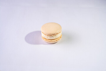 This is a French cookie called a macaron. It is two cookies made with meringue and cream sandwiched between them.