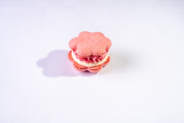This is a French cookie called a macaron. It is two cookies made with meringue and cream sandwiched between them.