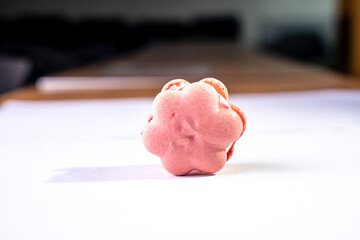 This is a French cookie called a macaron. It is two cookies made with meringue and cream sandwiched...