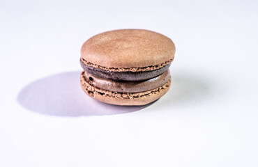This is a French cookie called a macaron. It is two cookies made with meringue and cream sandwiched between them.