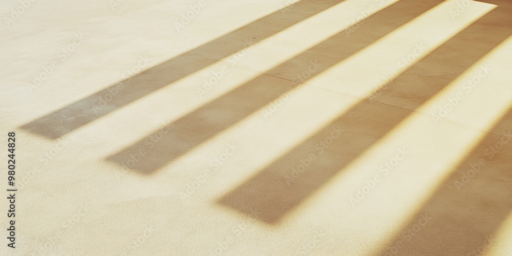 Poster minimalist beige stone surface with golden light beams creating shadows – tranquil and warm monochro
