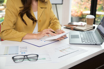 Business finance woman calculating budget numbers, Invoices and financial adviser working.