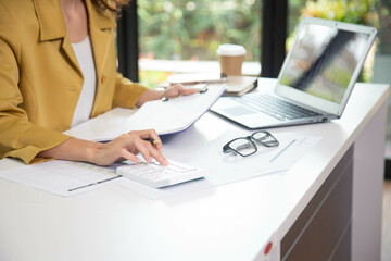 Business finance woman calculating budget numbers, Invoices and financial adviser working.