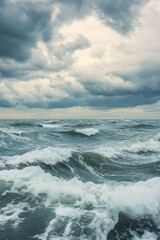 Fototapeta premium A dramatic seascape showcasing tumultuous waves under an overcast sky, capturing the essence of nature's power and beauty.