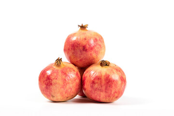 whole pomegranates isolated on white background.