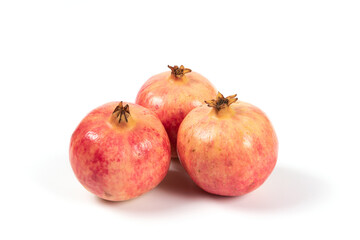 whole pomegranates isolated on white background.