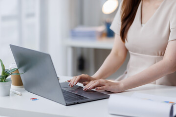 Businesswoman working at office with documents on his desk, doing planning analyzing the financial report, business plan investment, finance analysis concept	