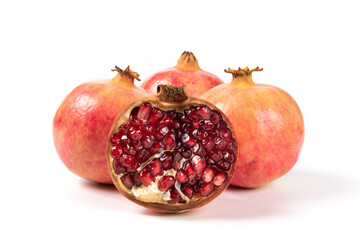 open pomegranates, and pomegranate seeds isolated on white background.