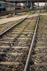 Naklejka premium View of train Railway Tracks from the middle during daytime at Amritsar railway station in India, Train railway track view, Indian Railway junction, Heavy industry