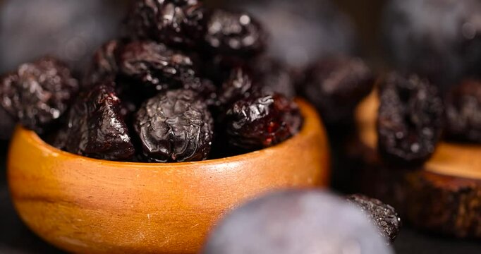 ripe purple plums and dried plums, close-up of purple plum fruits with prunes