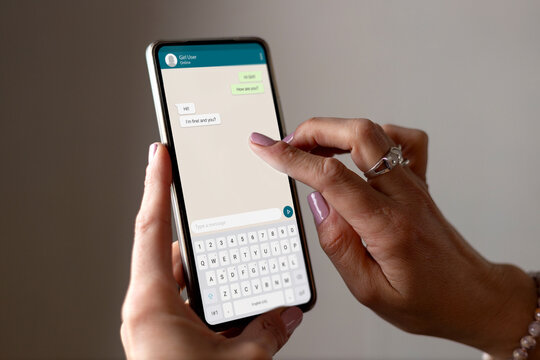 Woman showing a phone in her hand and chatting app on the screen. Communication Technology, application.