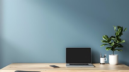 Minimalist Home Office Setup with Laptop and Potted Plant Clean and Efficient Workspace