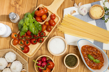 Top view of delicious food's special menu homemade preparing station of spaghetti with minced meat top tomato sauce and basil shooting placing elements serving with chef table decoration. Postulate.
