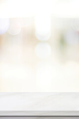 Empty vertical white table top, counter, desk background over blur  bokeh background, White marble stone table, shelf and blurred kitchen restaurant for food, product display mockup, template