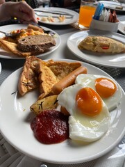 A breakfast setting with various dishes