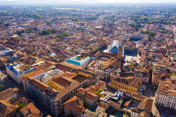 Obraz premium Aerial view of historical center of Italian city of Padua with blue roof of Palazzo della Ragione on sunny day