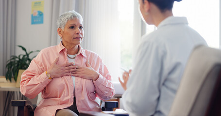 Doctor, consultation and elderly woman with chest pain for heart disease, advice and medical...