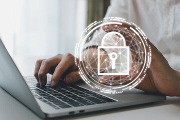 Business man holding virtual padlock icon and using laptop computer to secure personal information network login. Cyber security encryption and digital privacy protection concept.