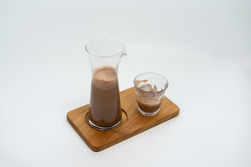 Iced Chocolate served in a clear glass isolated on white background.