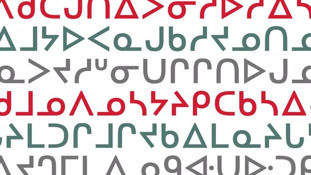 Randomly changing colourful Canadian First Nations letters (Cree) on white background. The display consists of random characters rather than full words. 4K motion graphics.
