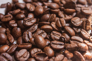 Coffee beans artistic shot, brown bean, arabica and robusta, café, caffeine, white background, freshness, shot is selective focus with shallow depth of field, taken at Cairo Egypt