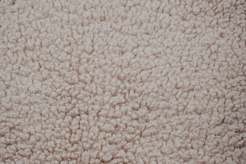 Textured fabric close-up showcasing soft, cozy fibers in neutral tones