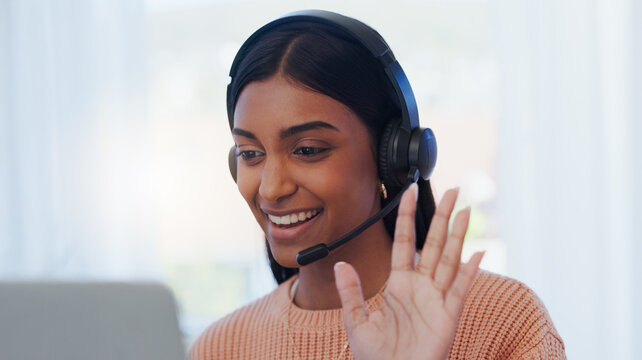 Call center, businesswoman and wave with laptop for videocall, telemarketing or consulting for online service. Freelance, advisor and hello with microphone for listening, answer questions and helping