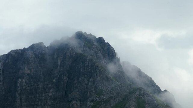 Lombardy, Italy - A Mesmerizing Sight of Grignetta Peak, Veiled in a Blanket of Mist - Close Up