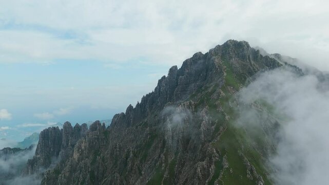 Lombardy, Italy - A Stunning View of Fog-Shrouded, Jagged Peaks Rises From the Rugged Terrain of Grignetta - Aerial Drone Shot