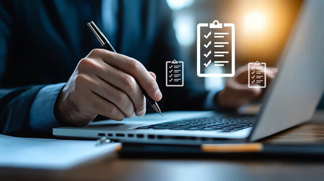 A professional person documenting tasks on a laptop, enhancing productivity with digital tools and checklists.