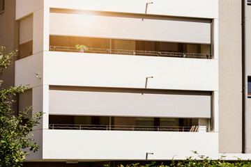 Balcony Shutters or Roller Blinds Outside. Modern Roller Shuttes on Balcony with Sunlight Close up. 