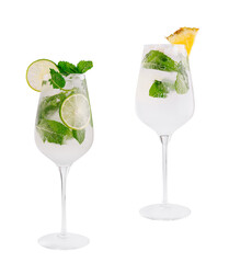 Two refreshing cocktails with lime, pineapple, and mint on white background
