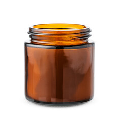 Dark glass jar with candle on a plain white background