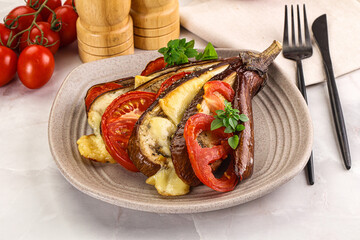 Baked tomato with mozzarella and tomato