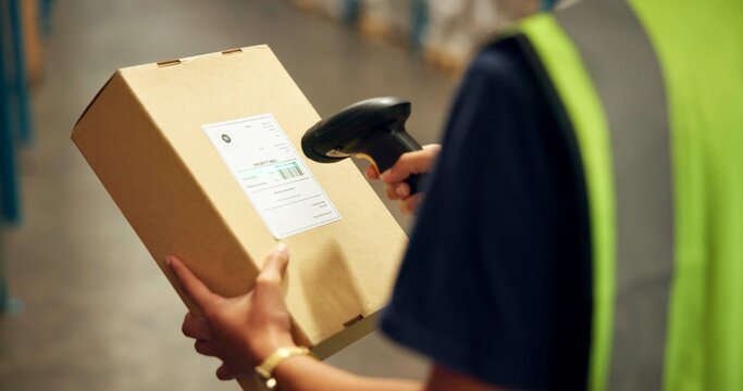 Employee, hands and box with scanner at warehouse for product, stocktaking and distribution. Manufacturing, person and barcode for delivery or package for supplier, supply chain and logistics