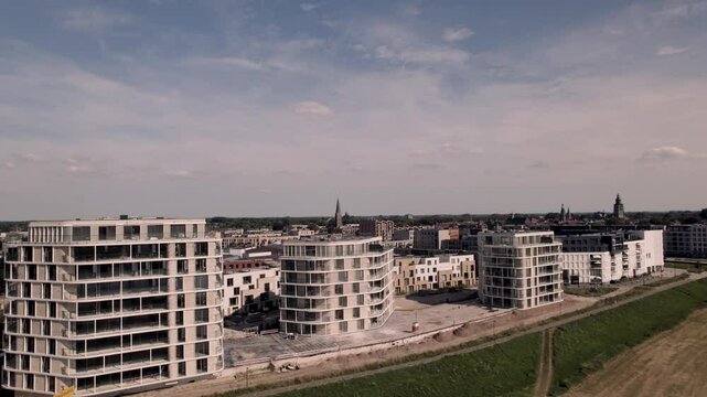 Construction site new high rise apartment buildings at the riverbed in Noorderhaven neighbourhood in Zutphen, The Netherlands, along floodplains
