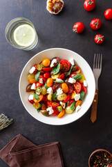 Salad with tomatoes, feta cheese, basil and balsamic vinegar. Healthy food. Vegetarian food.